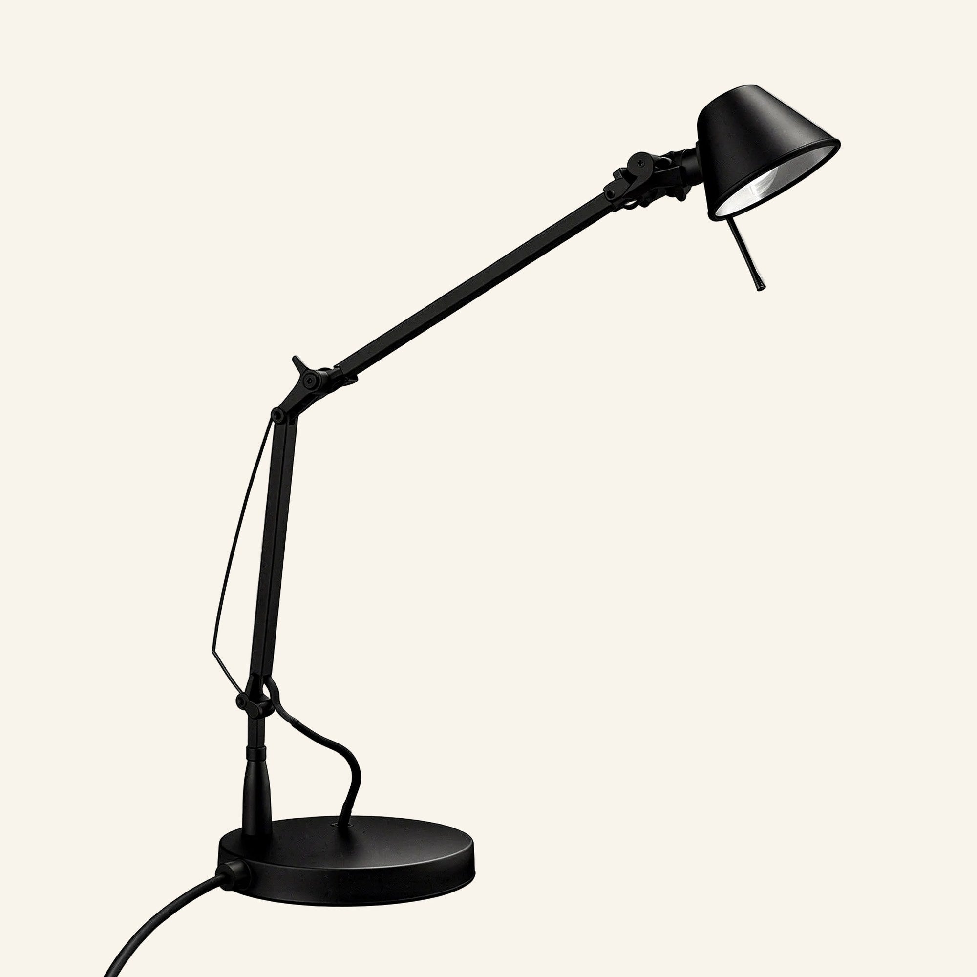 Matte black version of the articulated task lamp showing pivoting joints, cable-tensioned arm, and round weighted base