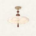Ruffled cream acrylic semi-flush ceiling light with stacked walnut beads and teardrop pull, mounted on a cream canopy against neutral background.