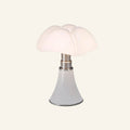 Mushroom-shaped table lamp with tiered scalloped opal acrylic dome shade and white lacquered metal flared base with brushed steel stem