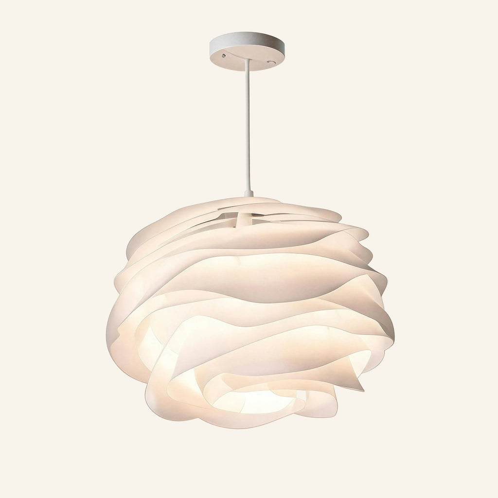 Matte-white acrylic pendant lamp with layered overlapping petals forming a rose-like bloom, suspended from a small white ceiling canopy