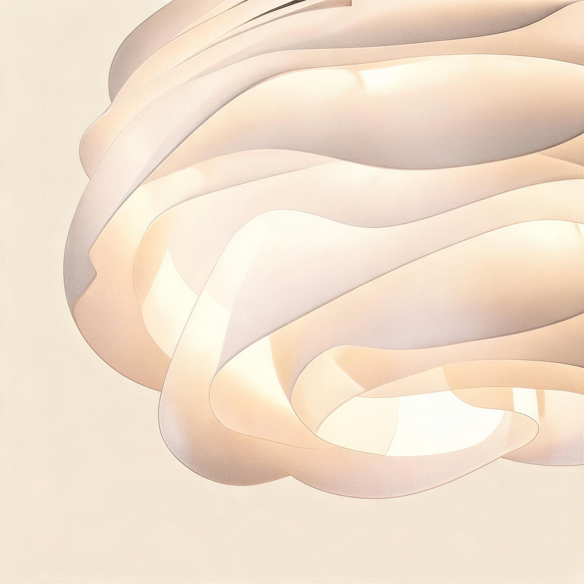 Close-up of curved acrylic petals overlapping in soft layers, warm interior glow filtering through the translucent matte-white shade