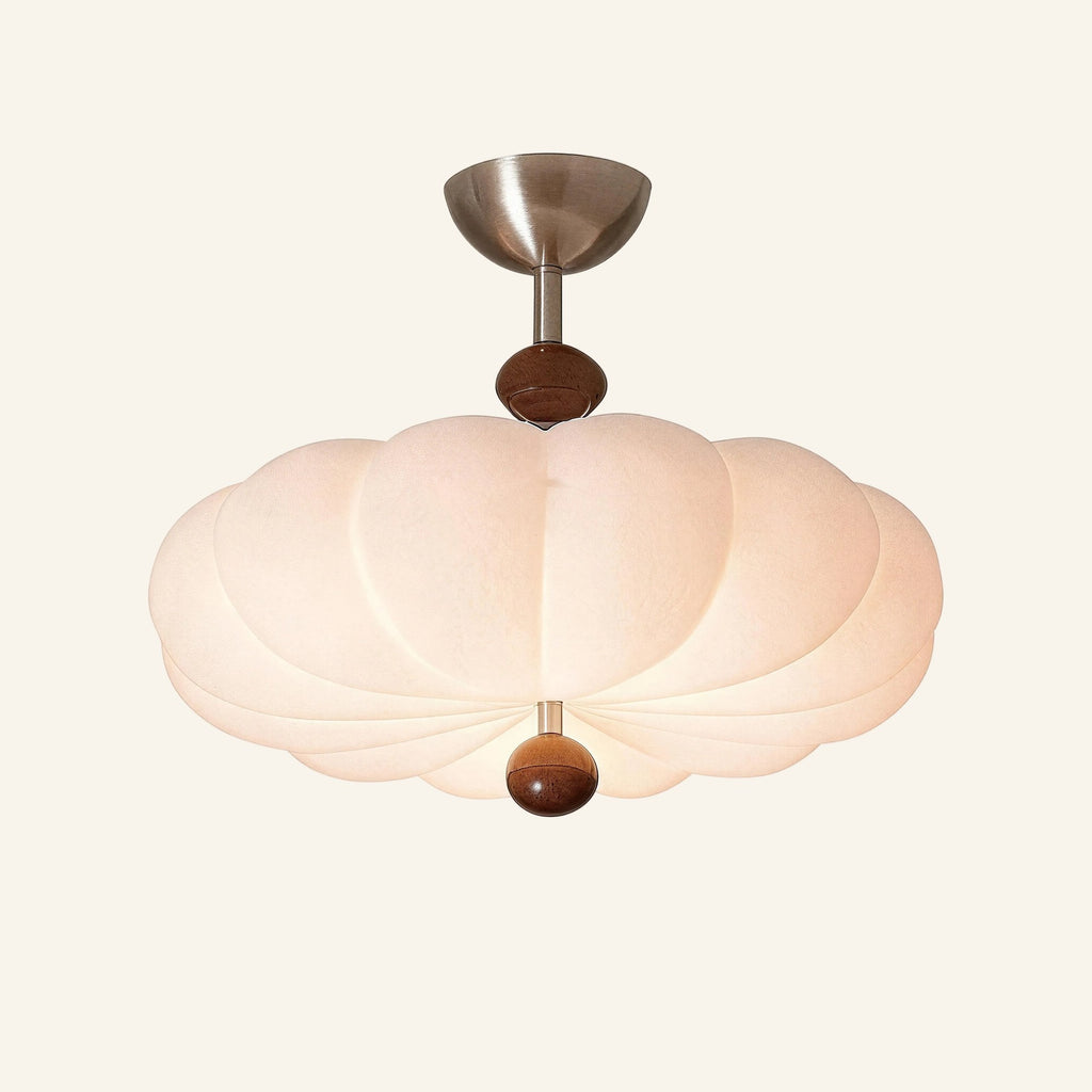 Ribbed cream pumpkin-shaped semi-flush ceiling light with walnut sphere finial and brushed chrome canopy on cream backdrop.