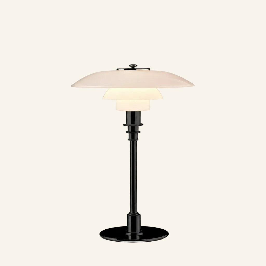 Alternate finish of the tiered glass table lamp featuring glossy black metal stand and three frosted shades on neutral background.